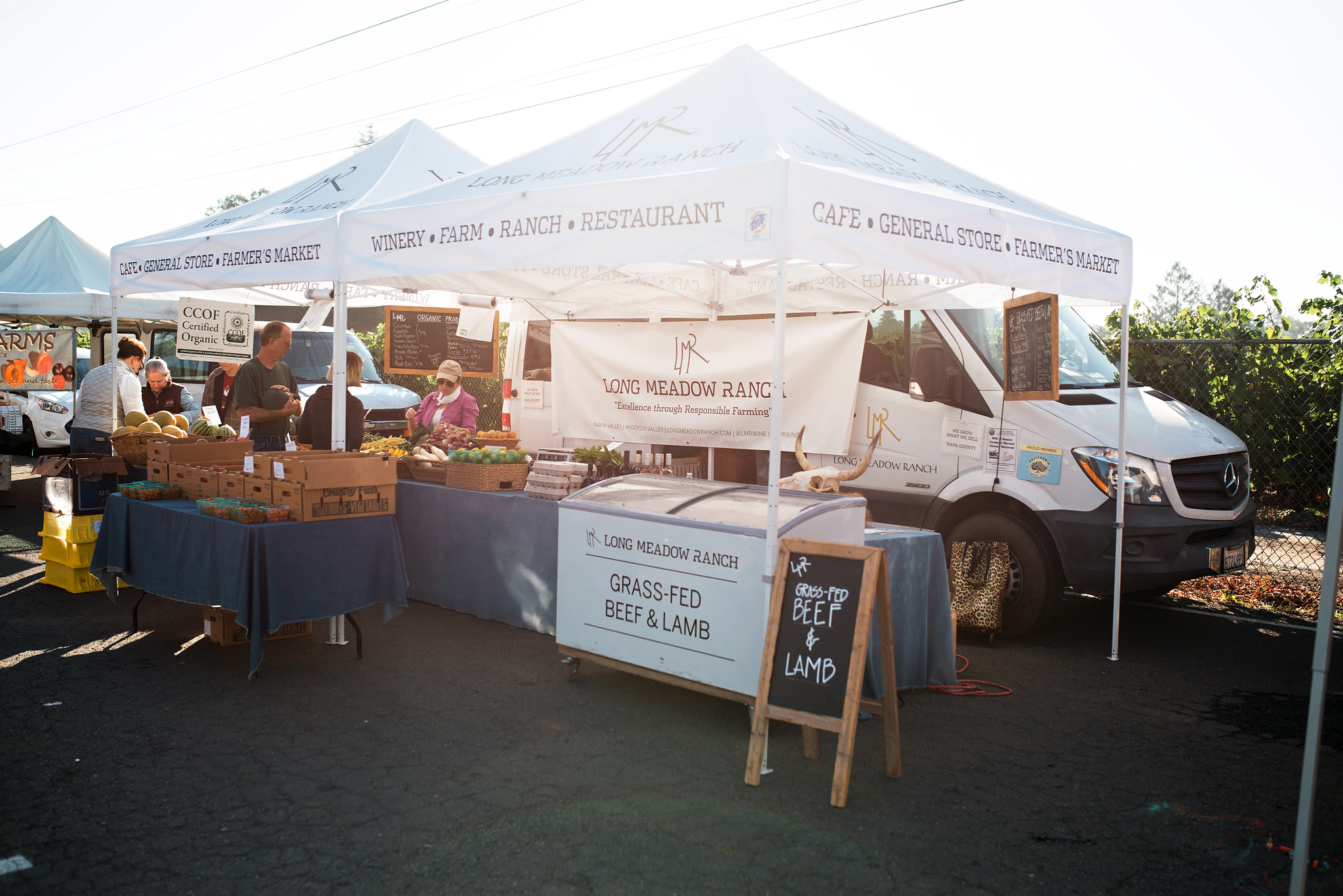 LMR_FarmersMarket_2018-6677 WEB Long Meadow Ranch stand at a local farmers market in St Helena, CA