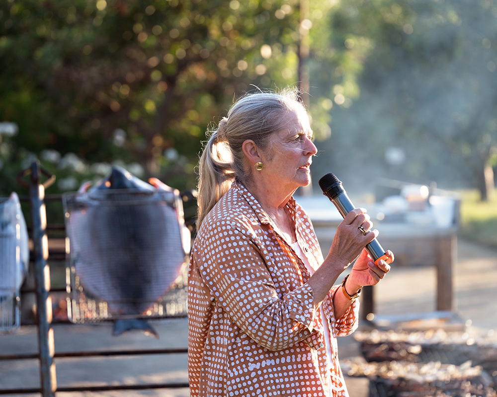 Woman speaking into a microphone