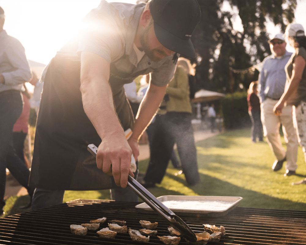 Man working the grill at an outdoor event